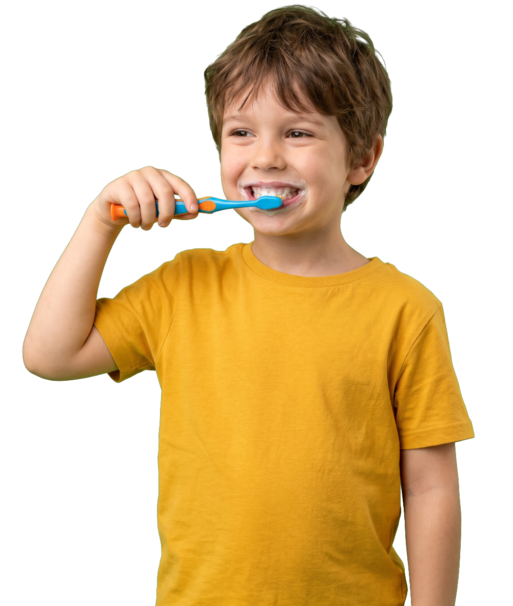 Smiling boy in a yellow t-shirt brushing his teeth.